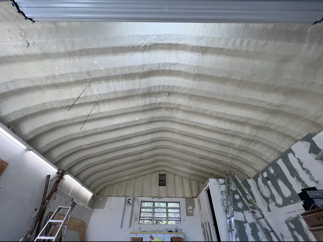 Spray polyurethane foam applied to the underside of a metal roof deck in Cave Springs